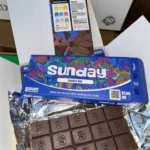 Sunday Crunch Mushroom Chocolate Bar in vibrant blue packaging with colorful design elements